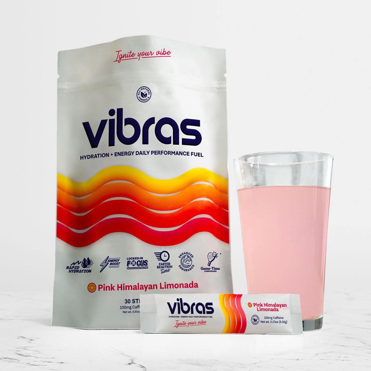 Vibras Pink Himalayan Limonada package with a glass of pink liquid on a white background